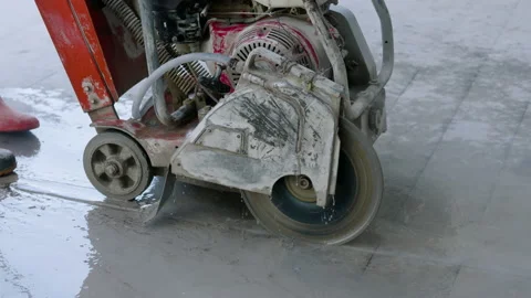 4K, Construction workers are using small machines to cut the concrete floor i Stock Footage 169628092