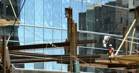 4k Construction workers placing I-Beam Stock Footage 51058210