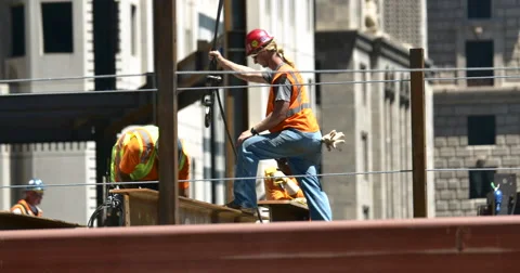 4K Construction workers Securing Hoisting I-Beam Real Estate Part 2 Stock Footage 51059451