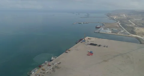 4K Container ships - fixed in the port of Bautino Kazakhstan on the shores of Stock Footage 99028267