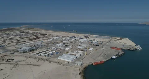 4K Container ships - fixed in the port of Bautino Kazakhstan on the shores of Stock Footage 99272719