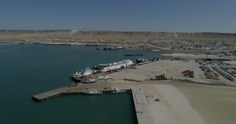 4K Container ships - fixed in the port of Bautino Kazakhstan on the shores of Stock Footage 103568165