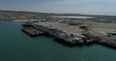 4K Container ships - fixed in the port of Bautino Kazakhstan on the shores of Stock Footage 103848490