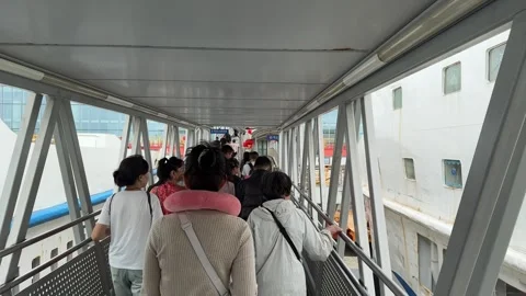 4K Continuous Passenger Flow in Haikou Port Modern Walkway Video stock 331971020