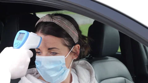 4K: Coronavirus COVID-19 Car Testing- Temperature, Mouth and Nose Swabs. Slow Stock Footage