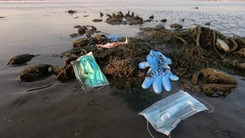 4K, Coronavirus waste polluting the environment. Disposable masks trash sea-Dan Stock Footage 134281986