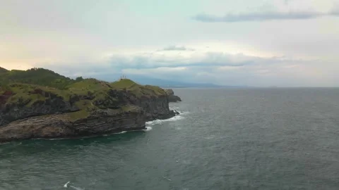 4K Counter-clockwise Close Aerial View of Songaksan (송악산) Mountain, Jeju Island Stock Footage 143864342