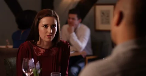 4K Couple having a big argument in restaurant with main focus on woman Stock Footage 62905021