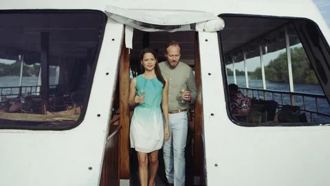 4K Couple on romantic vacation drinking wine on boat trip & looking at the view Stock Footage