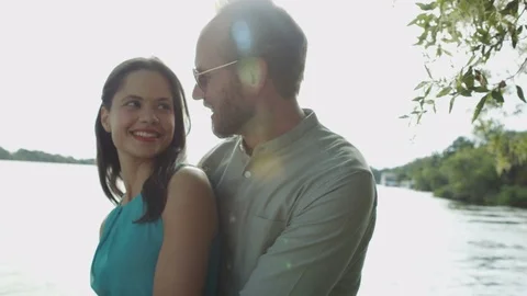 4K Couple on romantic vacation standing on boat deck & looking at the view Stock Footage
