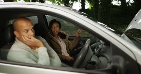 4K Couple stranded in broken down car henpecked man gets nagged by girlfriend Stock-Footage 68308841