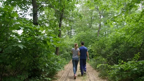 4K The couple is walking in the forest path 스톡 동영상 97522311