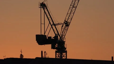 4K Crane machine modern skyscraper sunset sunrise site construction silhouette  Stock Footage 59769284