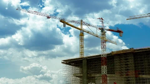 4K cranes over a scaffolded building at a construciton site timelapse Stock Footage 50715823