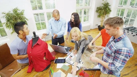 4K Creative fashion design team brainstorming for ideas in a business meeting Stock Footage