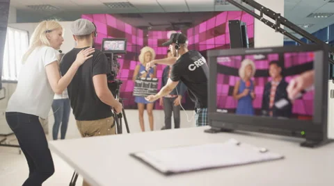 4K Crew member working behind the scenes on TV production set Stock Footage 67820051