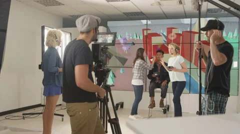 4K Crew member working behind the scenes on TV production set Stock Footage 67820230