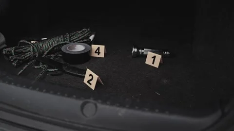 4k Crime Shot of Tools and Weapons in the Car Boot Stock Footage 321865472