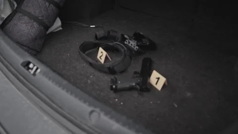 4k Crime Shot of Tools and Weapons in the Car Boot Stock Footage 321865520