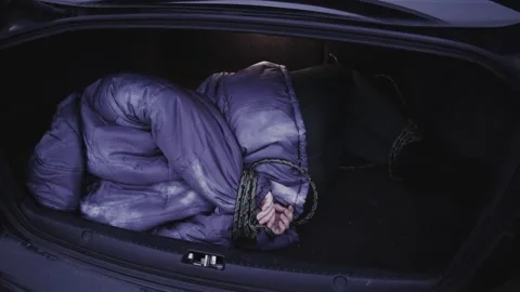 4k Crime Shot of Victim Hidden in the Car Boot Stock Footage 321865553