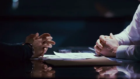 4K Criminal in handcuffs being interrogated by police officer Stock Footage 74063478