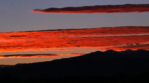 4K of Crimson Clouds at Sunset over the Rockies Stock Footage 54720104