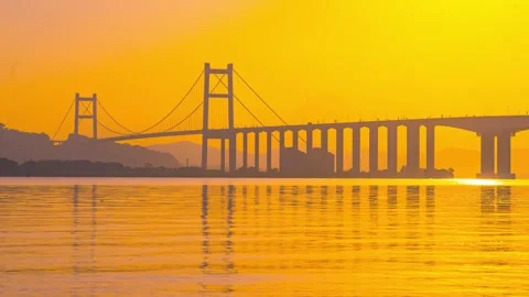 4K Cross Sea Bridge Reflection Golden Light 스톡 동영상 347345641