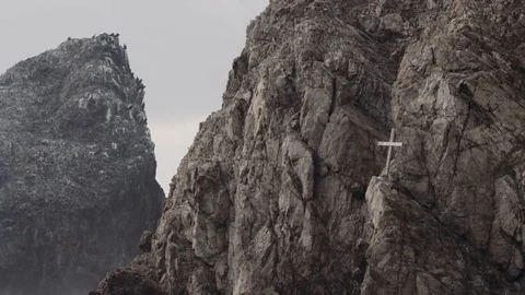 4K:  Cross upon Rugged Mountain Side/Spiritual Stock Footage 72684066