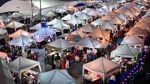 4K Crowd of people walking and shopping at night market in Bangkok Stock Footage 132055341