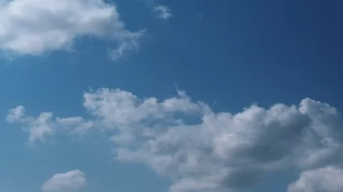 4K Cumulus Clouds timelapse on bright blue sky Stock Footage 263095928