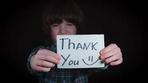 4K Cute Child Holding in Hands Thank you on Paper Vídeos de archivo 73526587
