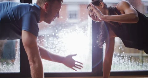 4K Cute flirty couple working out together & making each other laugh Stock Footage