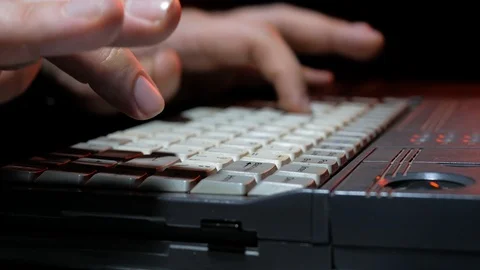 4k Cyber hacker works with old retro laptops at dark room software development Stock Footage 86731265