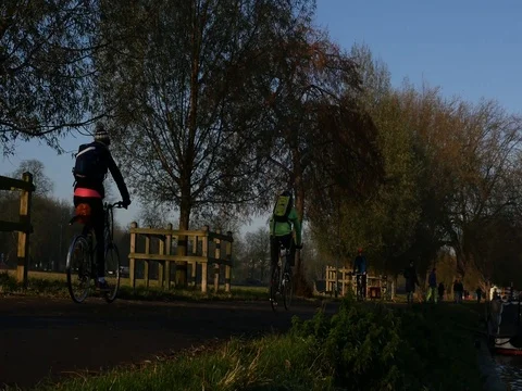 4K cycing by a river in cambridge Stock Footage 71116349