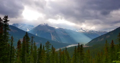 4K Dark Mountains, Sun Rays, Pan with High Altitude Trees Video stock 47119792