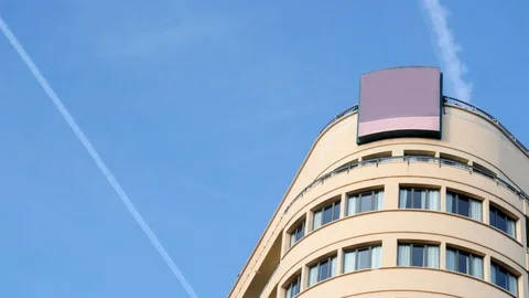 4k day low angle detail static shot of the top of a high rise art deco style Stock Footage 124532416