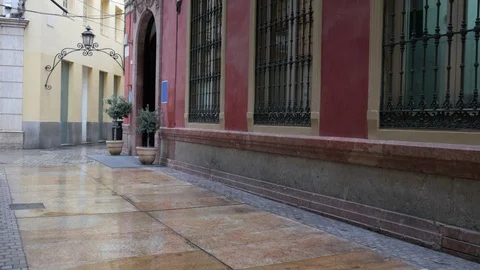 4k day medium wide angle static shot of the entrance of a burgundy historic Stock Footage 124583057