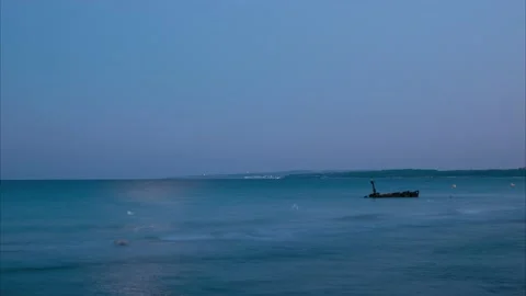 4k, Day to night timelapse of rusty shipwreck at sunset Stock Footage 222009553