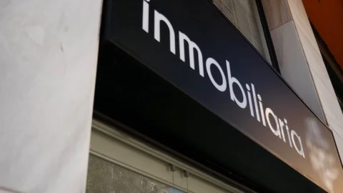 4k day tilt down shot of a real estate agency in a historical city. Stock Footage 123046795