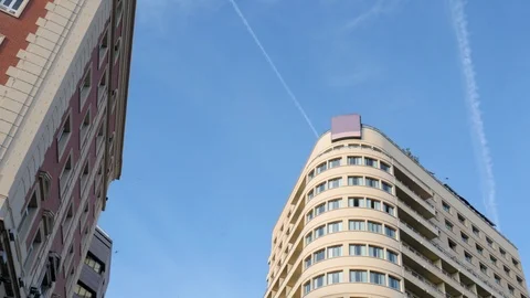 4k day wide low angle static shot of historic buildings on blue sky Stock Footage 124530414