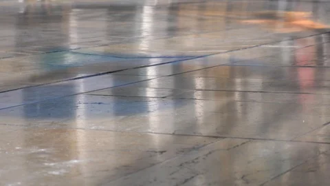 4k daylight close up  hand held static shot of a shiny paved street with Stock Footage 124216946