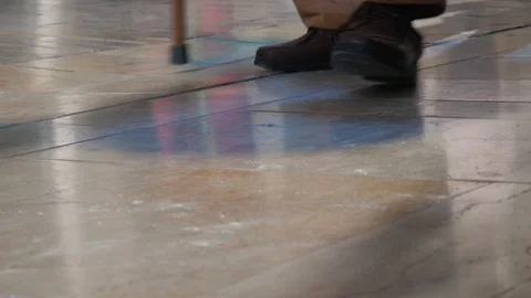 4k daylight close up  hand held static shot of the feet of an old man walking Stock Footage 124217276