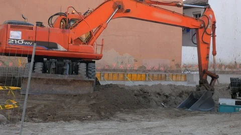4k daylight close up static shot of a red bulldozer excavator working. Stock Footage 123849129