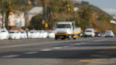 4k daylight slightly blurred static shot of a city avenue with cars and a Stock Footage 124204302