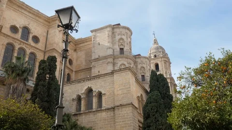 4k daylight wide low angle static shot of an ancient roman catholic cathedral Stock Footage 123853114