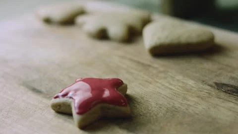 4K Decorated Red Star Cookie beside Plain Baked Cookies Stock Footage 342113496