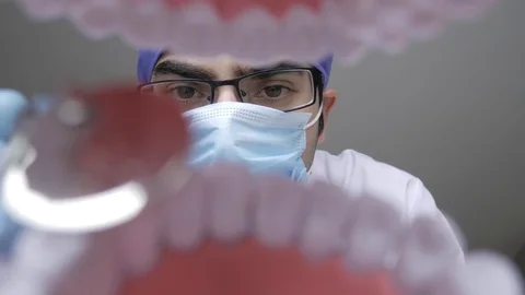 4K Dentist With Mirror Cheking Teeth View From Inside The Mouth Stock Footage 74126995