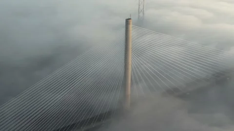 4k descending into clouds Queensferry crossing bridge Scotland Edinburgh 動画素材 223438855