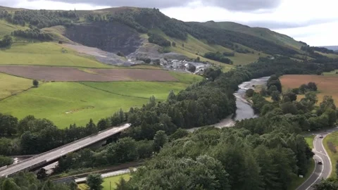 4K Descent of Active Limestone Quarry Beside the River Garry and A9 Blair Atholl Stock Footage 340502195