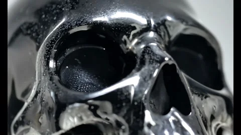 4K Detail Macro Shot of Chrome Skull Rotating Cinematic Video stock 278676977